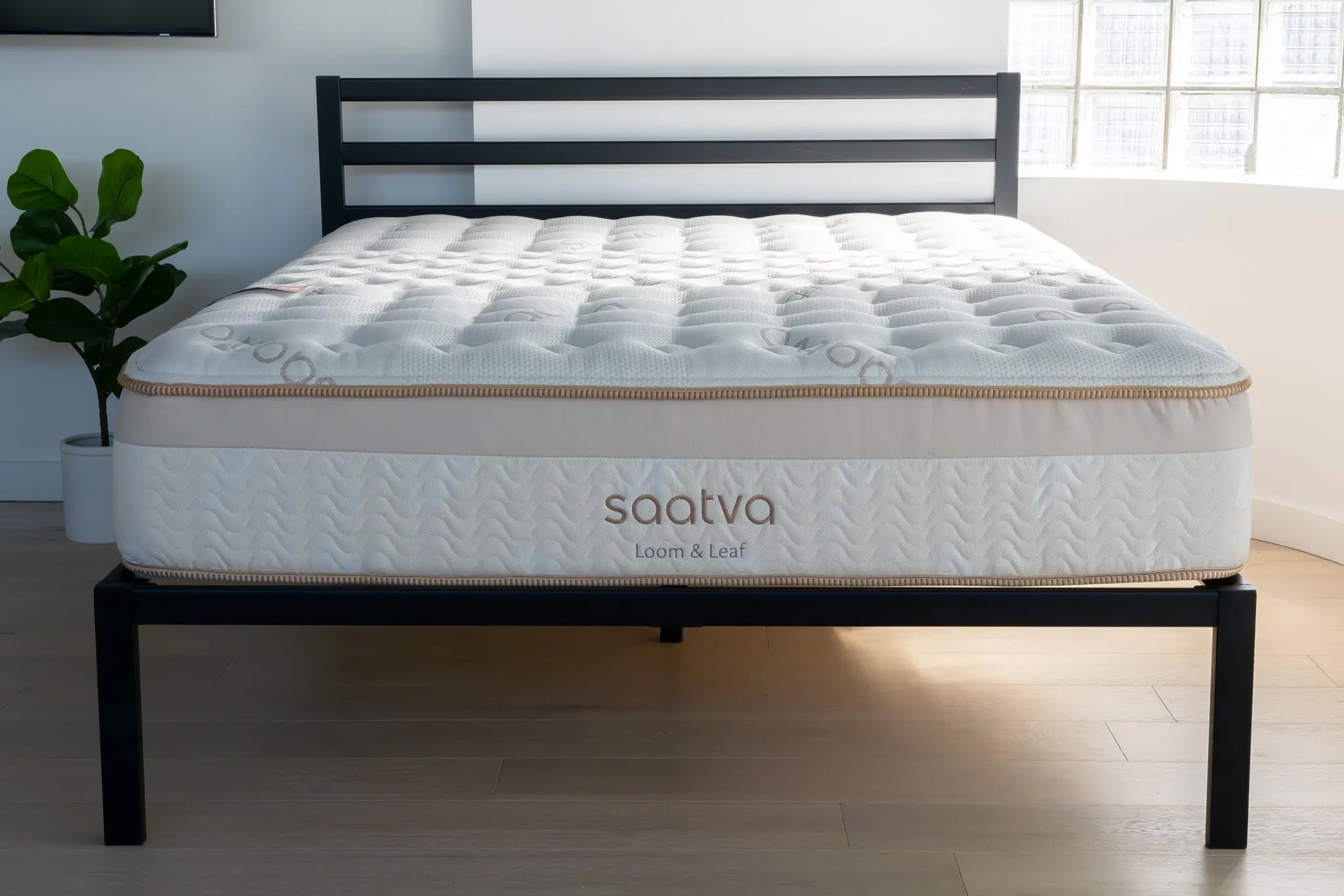 Saatva Loom and Leaf mattress in a modern bedroom